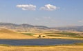 Plowed wheat fields, hills and sky. view. Royalty Free Stock Photo