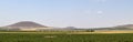 Plowed wheat fields, hills and sky. view. Royalty Free Stock Photo