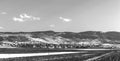 Plowed wheat fields, hills and sky. view. black and white. Royalty Free Stock Photo