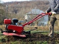 Plowing the land with a petrol plow Royalty Free Stock Photo