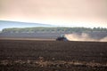 Plowing a red tractor field Royalty Free Stock Photo