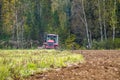 Plowing tractor.