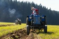 Plowing vintage veteran tractors on field on ploughing championship Royalty Free Stock Photo