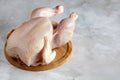 plucked chicken, a whole raw carcass of a bird.