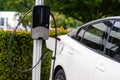 Plug-in hybrid car at a charging station Royalty Free Stock Photo