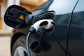 Plug-in hybrid EV car charging at charge station Royalty Free Stock Photo