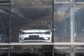 Plug-in hybrid Volkswagen e-Golf electric cars stands behind glass in the Glaserne Manufaktur - Transparent Factory, Dresden Royalty Free Stock Photo