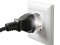 Plug inserted into electrical outlet Royalty Free Stock Photo