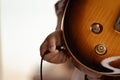 Plug jack cable in electric guitar,Hand inserts input jack to electric guitar Royalty Free Stock Photo