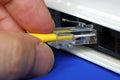 Plug the yellow network cable into the router Royalty Free Stock Photo