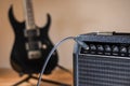 Plugged guitar and amp Royalty Free Stock Photo