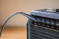 Plugged guitar and amp Royalty Free Stock Photo