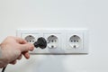 Plugging electrical cable to socket Royalty Free Stock Photo