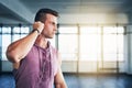 Plugging in that perfect playlist. a muscular young man listening to music at the gym. Royalty Free Stock Photo
