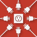 Plugs around outlet on red background Royalty Free Stock Photo