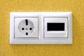 Plugs in electric and phone socket. Royalty Free Stock Photo