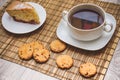 Plum biscuit cake for a cup of hot tea on a straw bedding with c