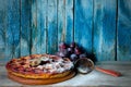 Plum Cake, Fresh Plums And A Strainer, Old Blue Background