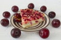 Plum cheesecake and plums Royalty Free Stock Photo