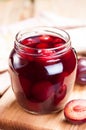 Plum compote in jar close up.