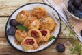 Plum dumplings made of leavened dough and fresh plum