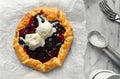 Plum jam galette on marble surface served with scoop of ice cream, top view Royalty Free Stock Photo