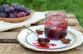 Plum jam with star anise and cinnamon. Fruit marmalade. Autumn canning and preserving. Conservation of harvest. Organic healthy ve Royalty Free Stock Photo