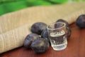Plum liqueur and plums Royalty Free Stock Photo