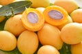 Plum mango tropical fruit produced in summer half cut on banana leaf Royalty Free Stock Photo