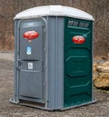 Plum, Pennsylvania, USA December 22, 2023 A portable toilet in a parking lot in Boyce Park