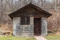 Plum, Pennsylvania, USA December 22, 2023 A small wooden and stone building in Boyce Park