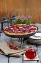 Plum pie on party table Royalty Free Stock Photo