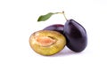 Plum with a slice and leaf. Royalty Free Stock Photo