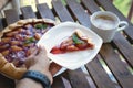 Plum tart with cinnamon. Portion of cake on a plate with shallow depth of field.