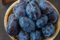 Plum variety Hungarian. Fruit harvest on the table in the kitchen. Autumn blue plum. Vitamin food bowl