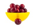Plum in a yellow plate isolated on a white background Royalty Free Stock Photo