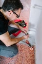 Plumber adjusting spanner to install heating