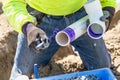 Plumber Applying Pipe Cleaner, Primer and Glue to PVC Pipes