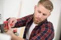 plumber attaches to gas pipe boiler with wrench Royalty Free Stock Photo