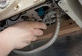 Plumber attaches to pipe gas boiler using adjustable wrench Royalty Free Stock Photo