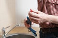 Plumber with caulking gun Royalty Free Stock Photo