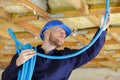 Plumber checking ceiling pipes Royalty Free Stock Photo