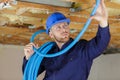 plumber checking ceiling pipes Royalty Free Stock Photo