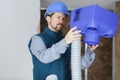 plumber checking ceiling pipes Royalty Free Stock Photo
