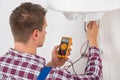 Plumber Checking Electric Boiler Royalty Free Stock Photo