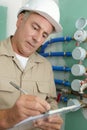 plumber checking water pipes Royalty Free Stock Photo