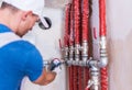 Plumber Checking on Water Supply Royalty Free Stock Photo