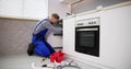 Plumber Cleaning Clogged Sink Pipe With Drained Cable Royalty Free Stock Photo