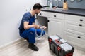 Plumber Cleaning Clogged Sink Pipe Royalty Free Stock Photo