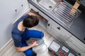 Plumber Cleaning Clogged Sink Pipe Royalty Free Stock Photo